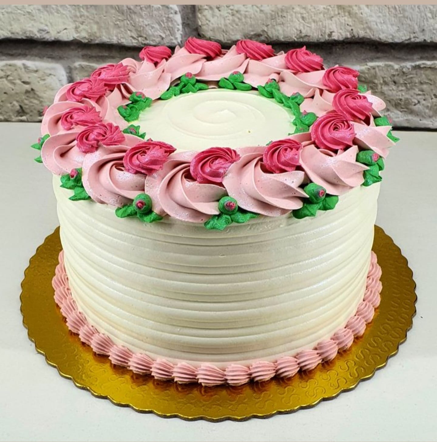 Decorative cake with pink and green frosting