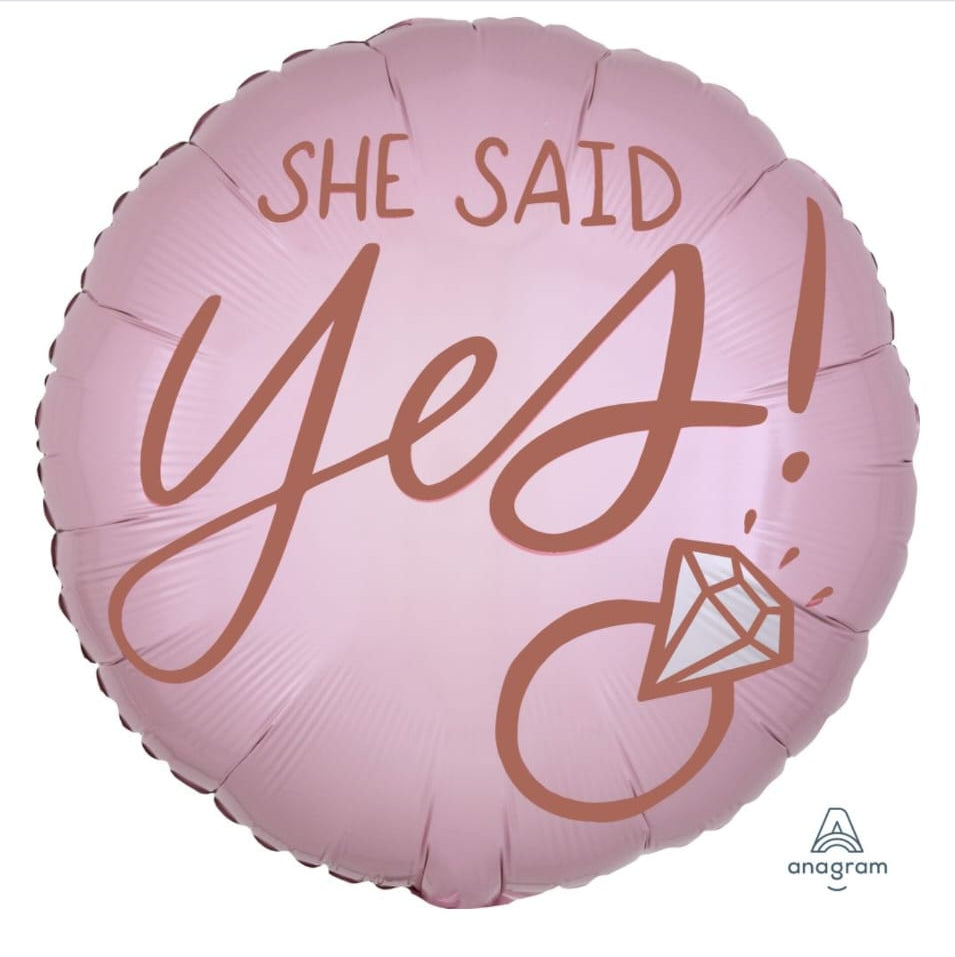 Pink balloon with 'She Said Yes!'